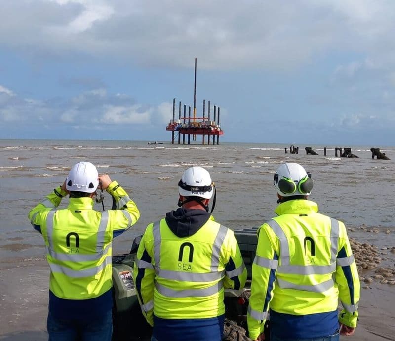 N-Sea workers in their flourescent equipment